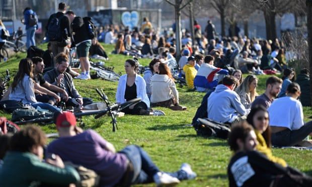 Police urge Britons to follow lockdown rules as warm weather pulls crowds